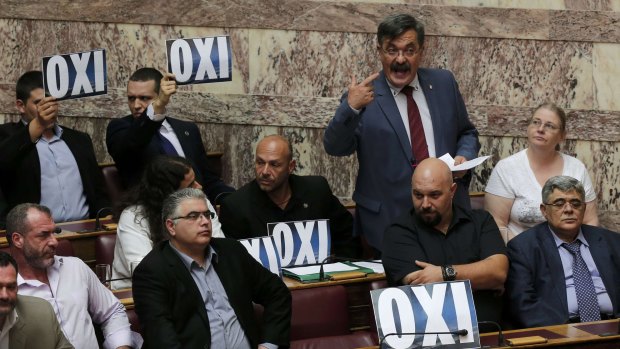 MPs of the far-right Golden Dawn party  oppose the austerity package in parliament.
