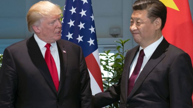 US President Donald Trump, left, and Chinese President Xi Jinping at the G20 summit in Hamburg last month.
