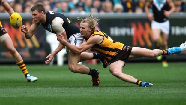 Hawthorn's Will Langford tackles Port's Brad Ebert during the second preliminary final in September. The teams will meet on Anzac Day in season 2015.