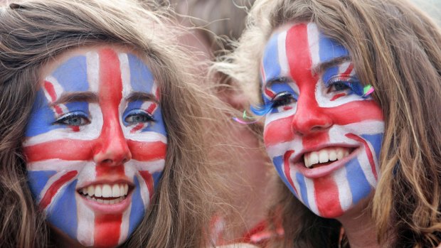 Girls with Union Jack flags face paint in England, UK