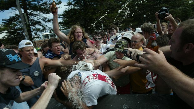 An angry mob bash and smash beer bottles on head of an innocent man at North Cronulla beach during the 2005 riots.