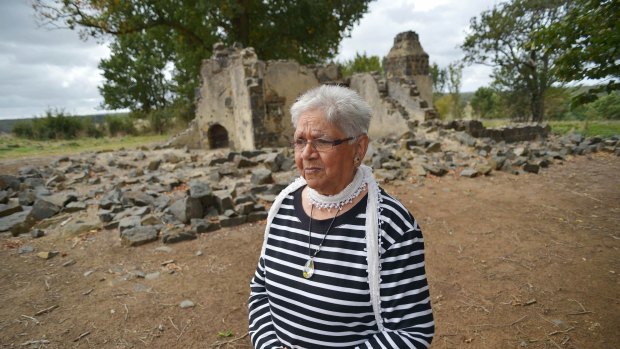 Laura Bell, Frederick Lovett's daughter, walks through the ruins at the Aborginal Mission station, Lake Condah. The five Lovett brothers lived here after returning from World War I.