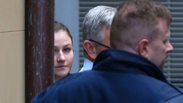 Harriet Wran is led to a prison services vehicle at the NSW Supreme Court in Sydney after pleading guilty on Wednesday.