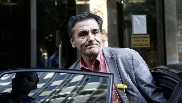 Euclid Tsakalotos, Greece's finance minister, leaves the finance ministry building in Athens on Thursday.