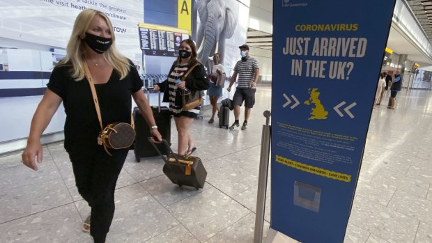 Passengers arrive at Heathrow Airport, London. People arriving from COVID-19 hotspots are supposed to self-isolate for 14 days, but less than 20 per cent are doing so.