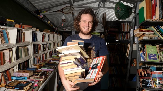 Yarran Jenkins uses an honesty payment system at his Bardon book shop, Logical Unsanity.