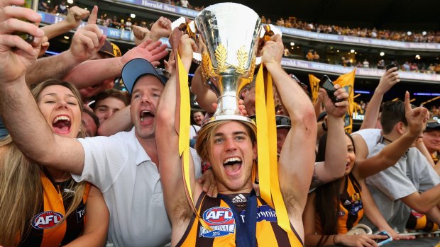 Ryan Schoenmakers celebrates with the premiership cup.