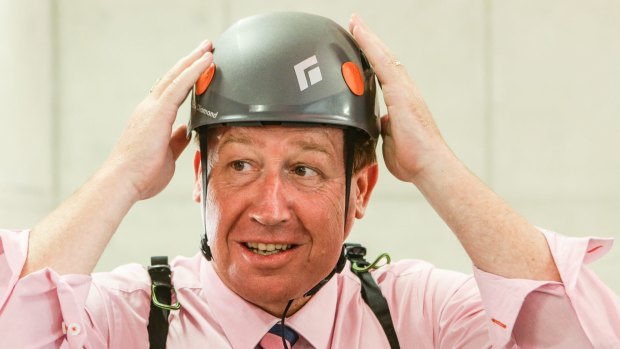 Safety first: Deputy Premier and Arts Minister Troy Grant prepares to ride the flying fox at Barangaroo. 