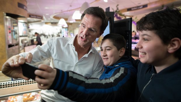 Prime Minister Mark Rutte poses for a photo with supporters during a campaign event in Barendrecht, Netherlands.