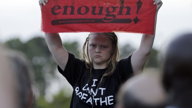Asia Cromwell wears a T-shirt honouring Eric Garner during a rally for the killing of Walter Scott.