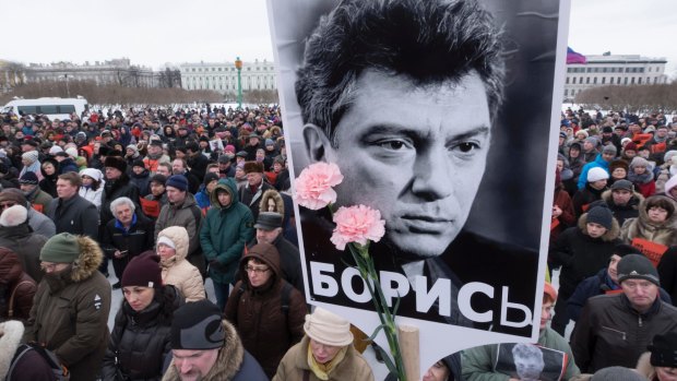 People gather in memory of opposition leader Boris Nemtsov, in St. Petersburg, Russia, on Sunday,.