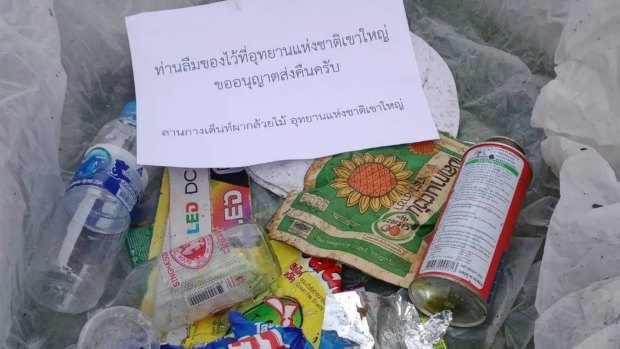 A box of trash left at a national park is ready to be mailed back to its original owners along with a note.