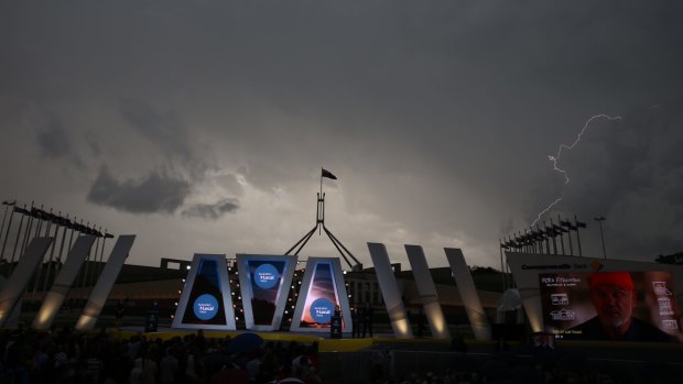 A storm passes over Australian of the Year ceremony.