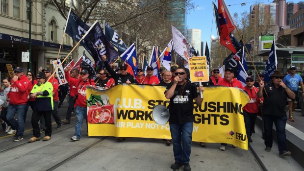 Thousands of people walk down Bourke Street to Parliament House, protesting about the sacking of 55 workers from CUB.