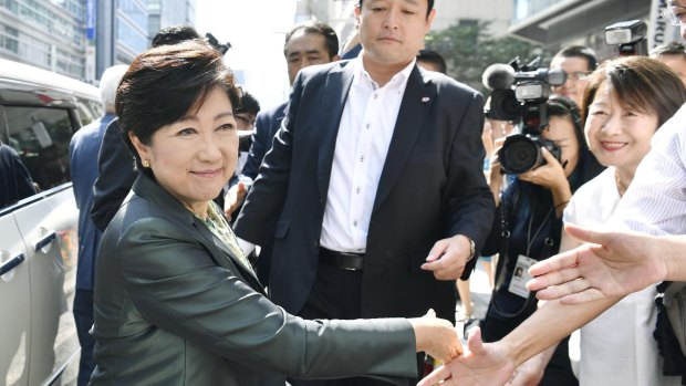 Tokyo Governor Yuriko Koike, left, leader of Party of Hope, begins campaigning for her party.