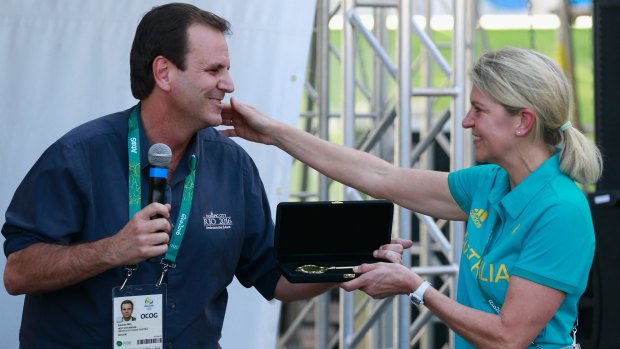 Eduardo Paes and Kitty Chiller at the Olympic Village on July 26.