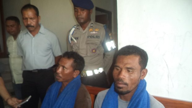 Indonesian crewmen Isai Rano (left with blue towel) and Lajimu (right) from Kupang at the East Nusa Tenggara water police office.