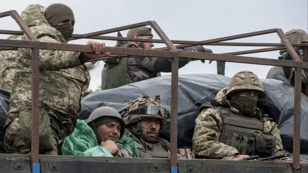Ukrainian servicemen in a military truck near Krasnoarmiisk, Donetsk region, in eastern Ukraine on Tuesday. 