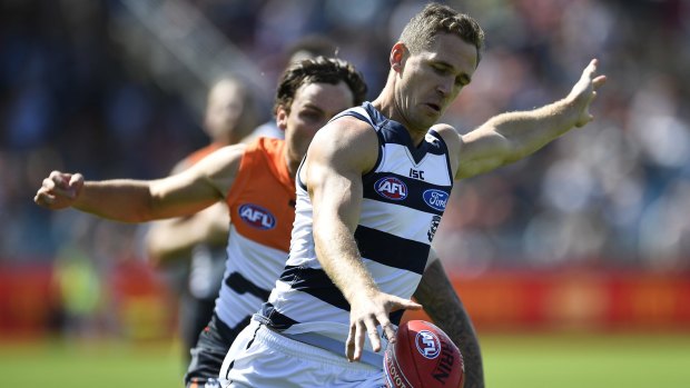 Joel Selwood of the Cats kicks the ball during the round two AFL match between the Greater Western Sydney Giants and the Geelong Cats at Manuka Oval on Sunday.