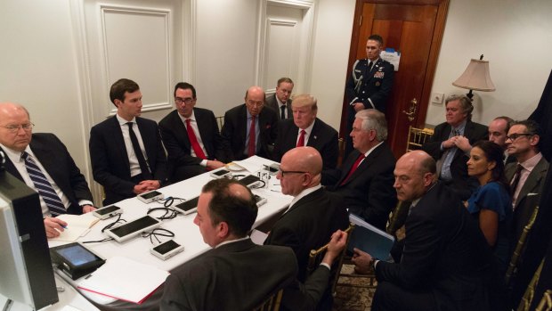 President Donald Trump receives a briefing on the Syria military strike from his National Security team at Mar-a-Lago after the strike.