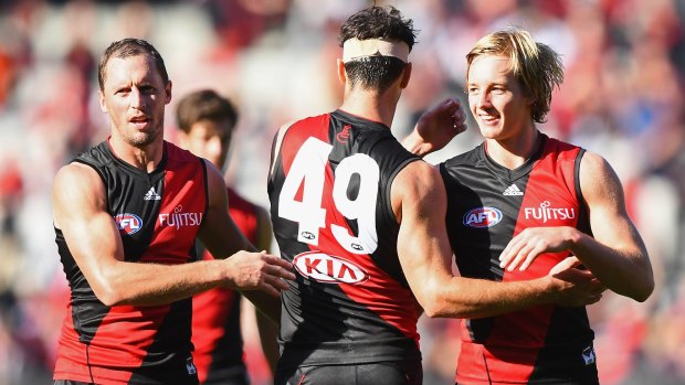 James Kelly, Matt Dea and Darcy Parish celebrate after beating Melbourne in round two. 