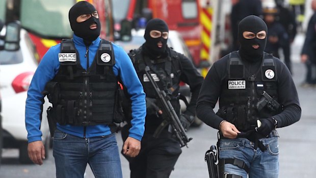 Military and police conduct an operation in Saint-Denis on Wednesday.