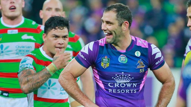Cameron Smith  laughs as Issac Luke looks on shortly after Smith kicked Luke in a tackle.