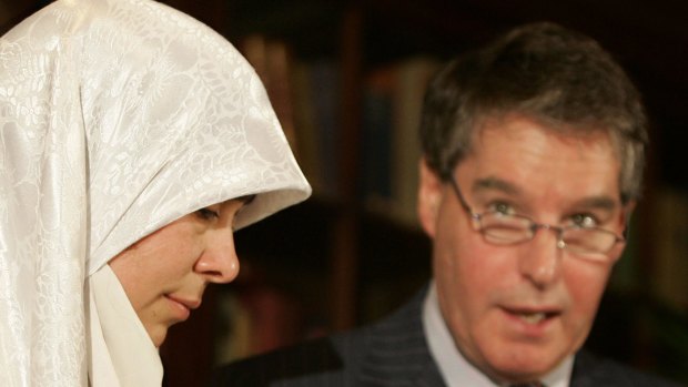 Maha Khadr listens as Canadian lawyer Dennis Edney reads her prepared statement in 2005.