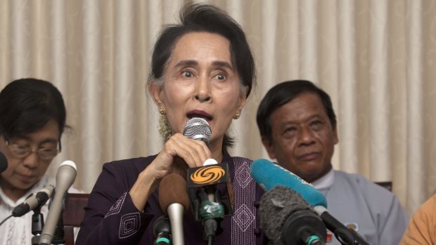 Myanmar opposition leader Aung San Suu Kyi talks to journalists during a news conference at her residence in Naypyitaw earlier this month. 