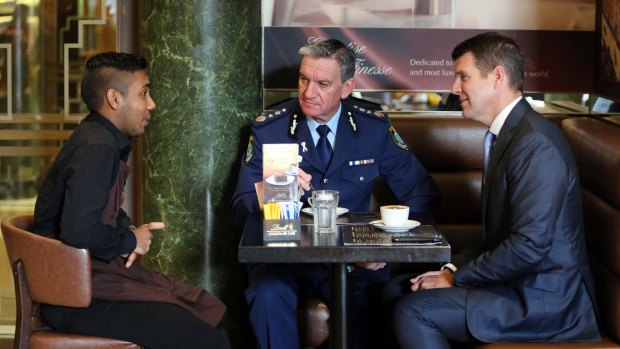Then Premier Mike Baird and Police Commissioner Andrew Scipione visited the Lindt Cafe and speak to survivor Joel Herat one year after the siege.