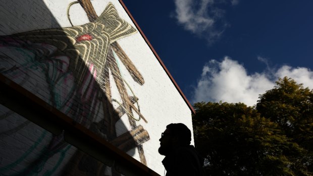Artist Thomas Jackson has been fighting against the weather to finish his mural in Camperdown.
