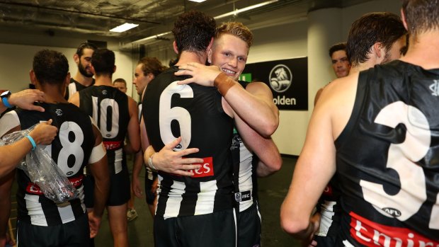Magpies celebrate the win.
