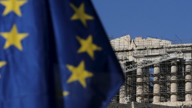 An European Union flag flutters near the Parthenon in Athens.