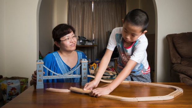 Nancy Ju and Allan Liang, 9, in their Chisholm home.