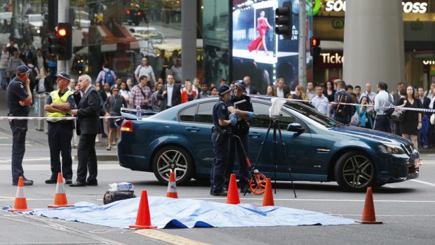 'Extremely tragic': Police at the scene of the fatal accident opposite Southern Cross Station.