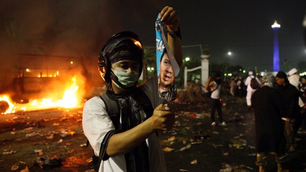 Protesters clash with police in central Jakarta.