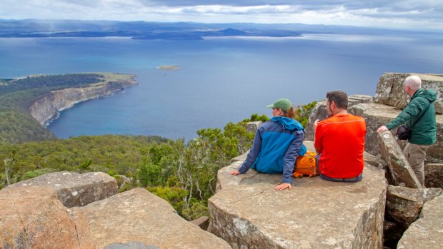 Hikers enjoy the view from the summit of Bishop and Clerk on Maria Island.