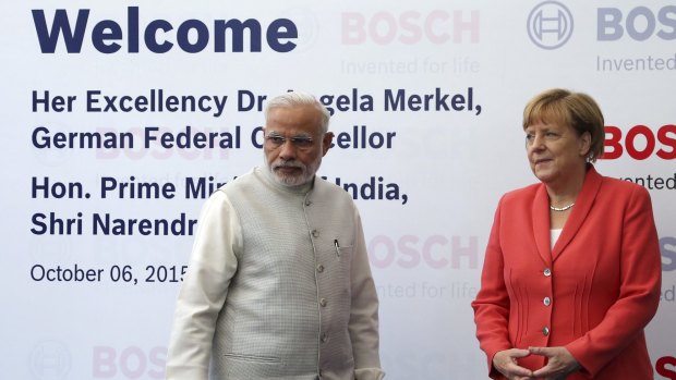German Chancellor Angela Merkel, right, and Indian Prime Minister Narendra Modi at German engineering company Bosch's vocational centre in Bangalore, India, on Tuesday.