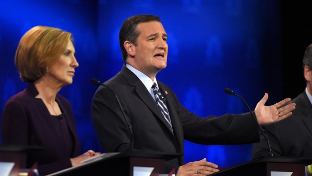 Ted Cruz, right, makes a point as Carly Fiorina looks on during the debate. 