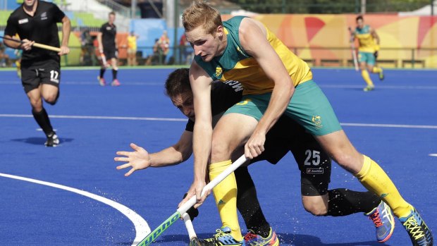 Australia's Daniel Beale fights for the ball against New Zealand's Shea McAleese.