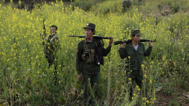 Rebel soldiers of the Myanmar National Democratic Alliance Army (MNDAA) patrol near a military base in Kokang last week.