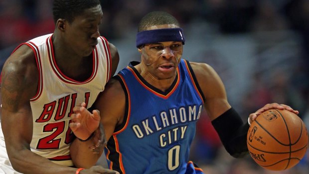 Masked avenger: Russell Westbrook is fouled by Chicago's Tony Snell.