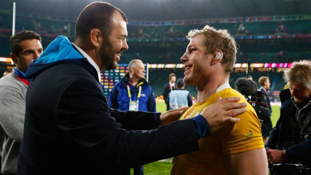 Home away from home: Michael Cheika and David Pocock embrace after the Wallabies beat Argentina at Twickenham.
