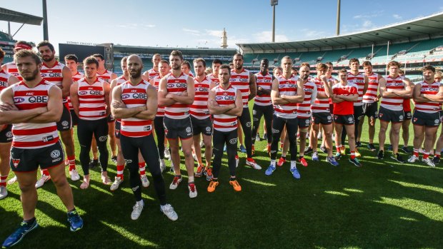 Taking a stand: Swans players show solidarity with Goodes on Thursday.