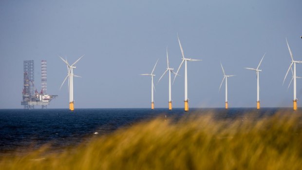 A jack-up rig stands near to Teesside Offshore Wind Farm, near Hartlepool in the UK.