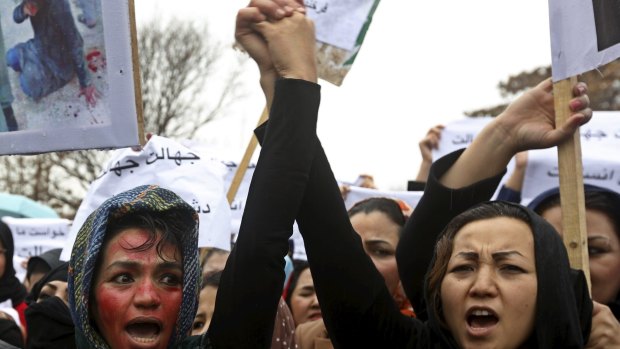 Afghan women chant slogans at a protest to condemn the killing of 27-year-old Farkhunda, who was beaten  and set on fire in Kabul after allegedly burning a Koran.