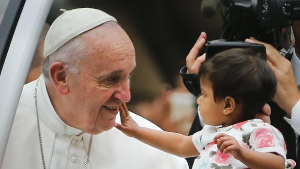 Pope Francis and an admirer in Philadelphia on Sunday. 