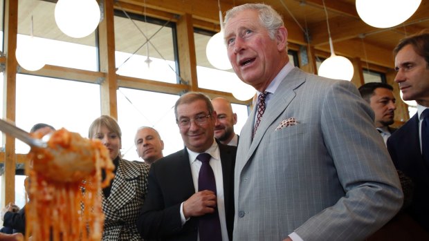 Britain's Prince Charles is given a typical dish of pasta all'amatriciana during his visit to the 2016 earthquake-hit town of Amatrice, central Italy.