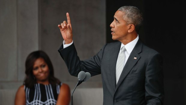US President Barack Obama and first lady Michelle Obama at the dedication ceremony for the Museum of African American History and Culture on the National Mall in Washington.