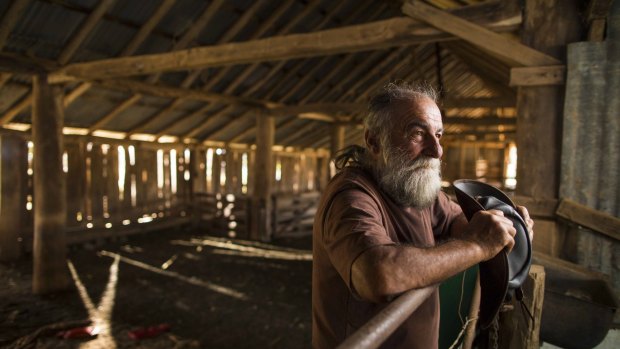 As the sun sets on the circa-1850 shearing shed, Dennis Rose, a resident of Wells Station for more than 27 years, ponders the future of his home.  